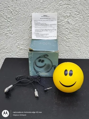 Mini Teléfono Retro Tumbler Mini-phone E12 Emoji Cara Feliz Amarillo