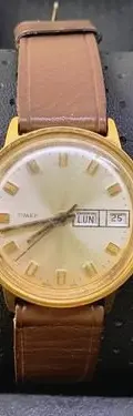 Reloj Mecánico Cuerda Timex Dorado Vintage 70s Para Reparar  Café Dorado Beige — Coleccionables vintage, años 70s