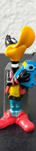 Figura Looney Tunes Pato Lucas Rockstar Pvc 1995 Pluma — Coleccionables vintage, años 90s