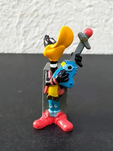 Figura Looney Tunes Pato Lucas Rockstar Pvc 1995 Pluma