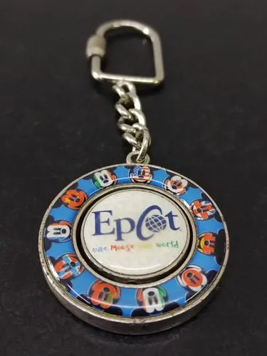 Llavero De Colección Epcot Disney Metálico Giratorio 3.8cm Azul, Rojo Y Blanco