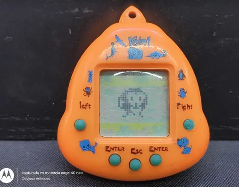 Mascota Virtual De Juguete 16 En 1 Tamagotchi Usado Detalle Naranja